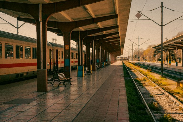 A deserted train station platform in Varna, Bulgaria, captured at sunset with warm tones.